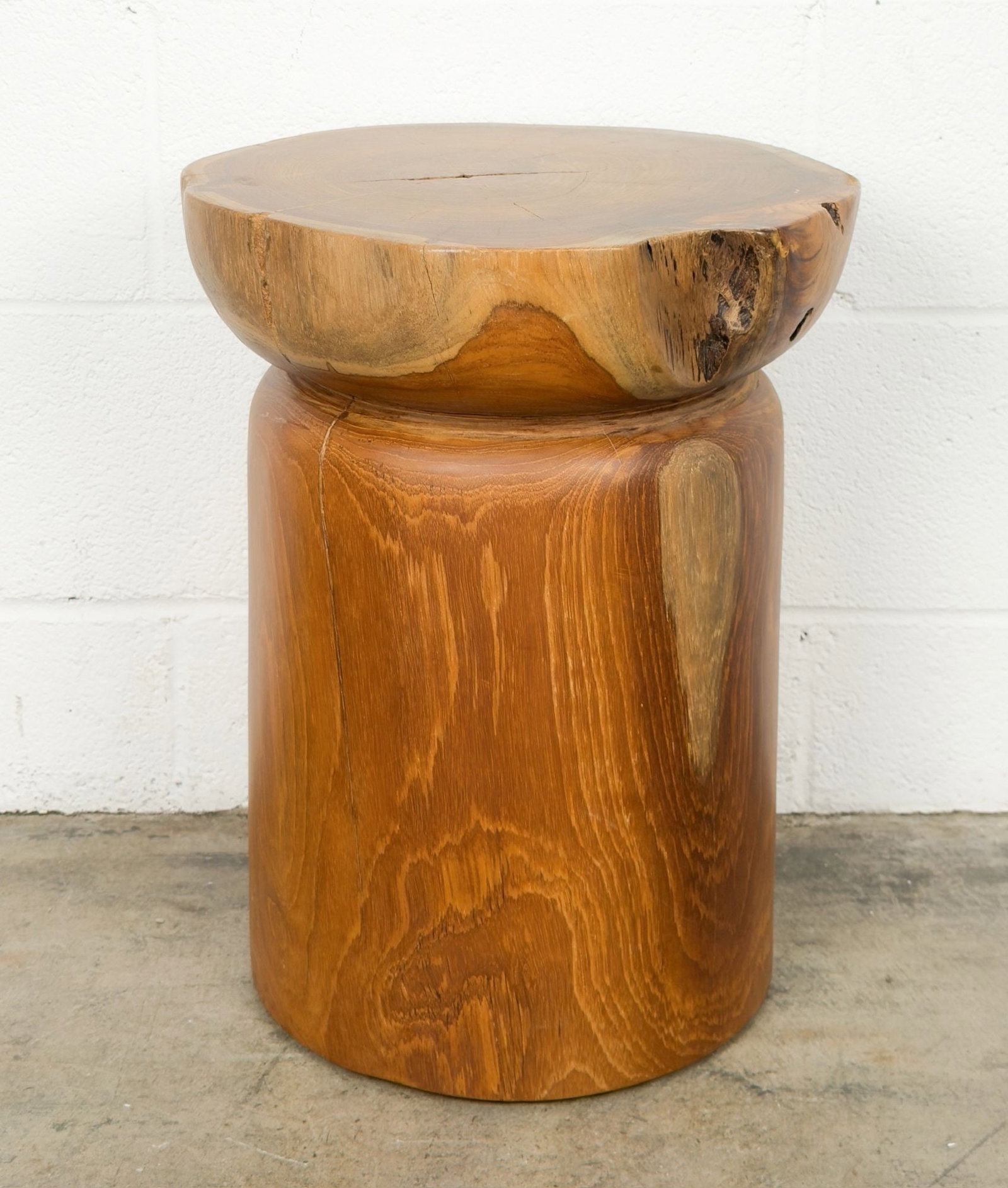Mermelada Estudio for CB2 Teak Natural Round Bathroom Stool: Designed by Mermelada Estudio and made of Indonesian teak root. Organic shape spotlights natural holes, knots and graining. Dimensions: Approximately 18.5 in H x 14 in W x 14 in D. Weighs approximatel