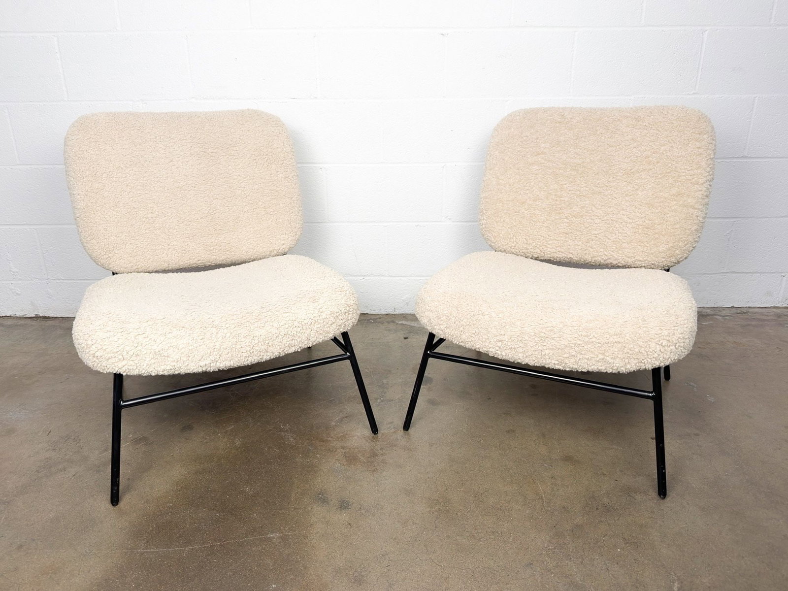 Pair of Zara Home Faux Shearling Accent Chairs: Constructed of faux shearling upholstery with black metal legs and frame. Dimensions: Approximately 28.5 in H x 24 in W x 24 in D. Weighs approximately 35 lbs. LOCAL PICK UP INFORMATION:Wednesday, Sep