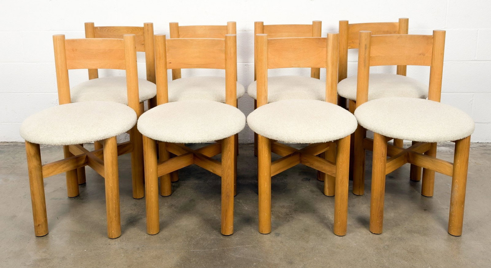 Set of 8 House of Leon Teddy Dining Chairs: Lot includes set of eight dining chairs made of wood and acrylic boucle upholstery. Dimensions: Each chair is approximately 33 in H x 19 in W x 19 in D. Total weight is approximately 176 lbs. LOCAL