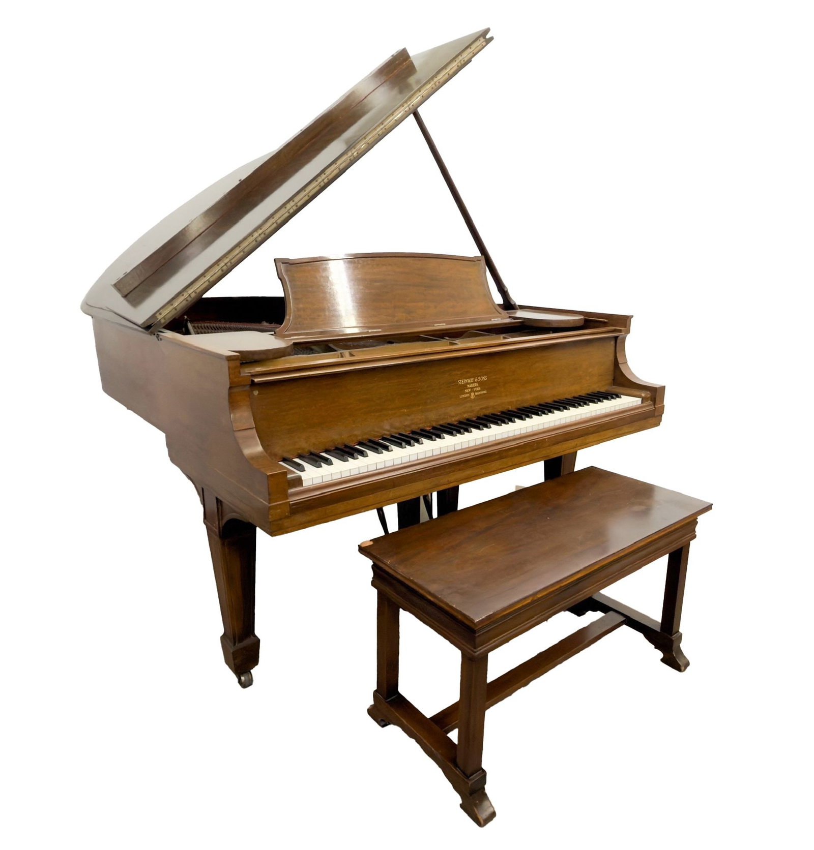Steinway & Sons Baby Grand Piano and Bench, Circa 1910: Baby Grand Piano features simple wooden design. Serial number 140282. Includes Steinway foundry steel casting and piano bench. Dimensions: Piano is approximately 39 in H x 58 in W x 72 in D. Bench is 