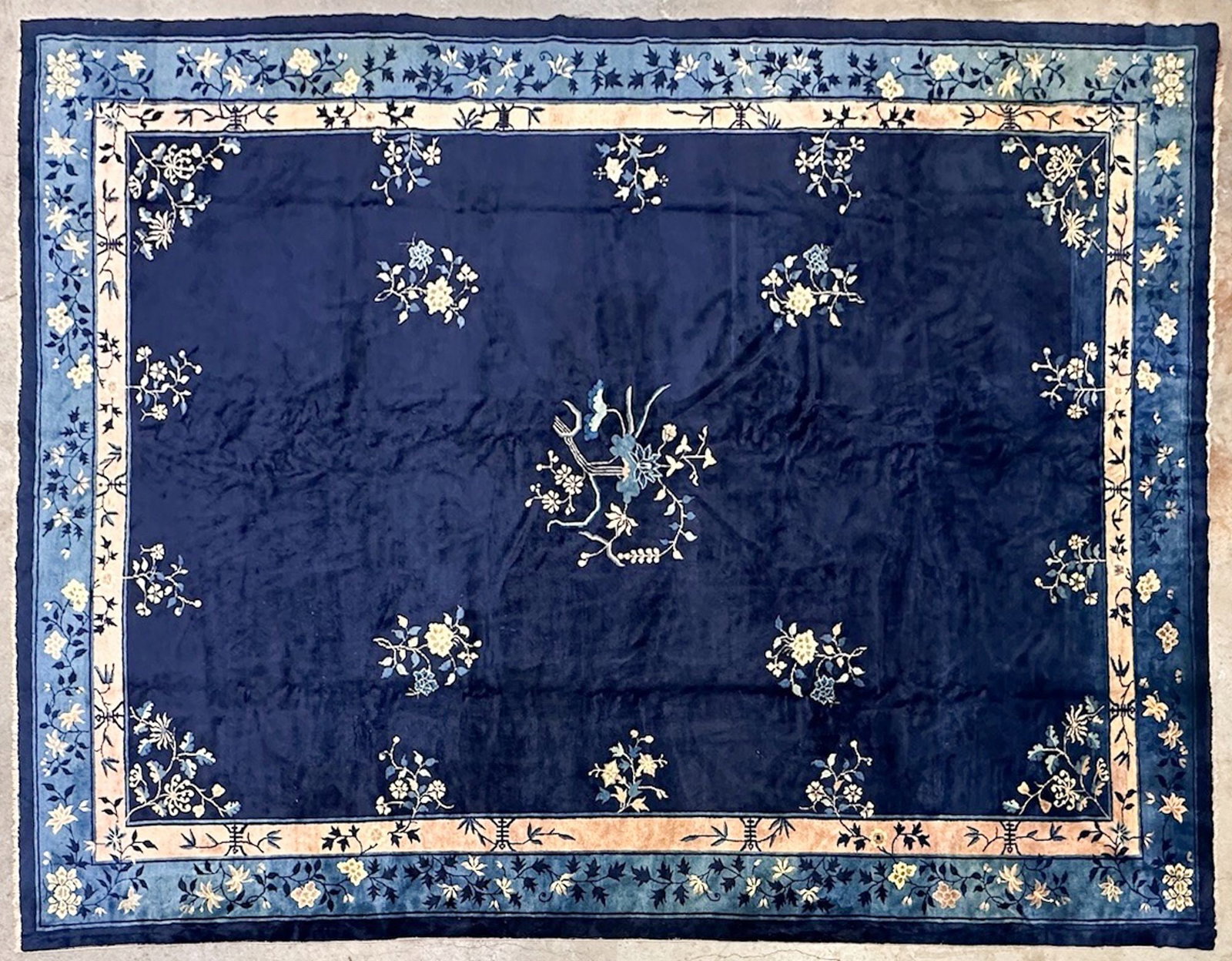 China Rug Peking Art Deco Circa 1930, 13.3' x 9.8': Indigo and royal blue color. Hand-knotted wool rug. Traditional floral motif. Dimensions: Rug is approx. 160 in W x 118 in L. Weighs 70 lbs. LOCAL PICK UP INFORMATION:Wednesday, September 16, 10:00 AM