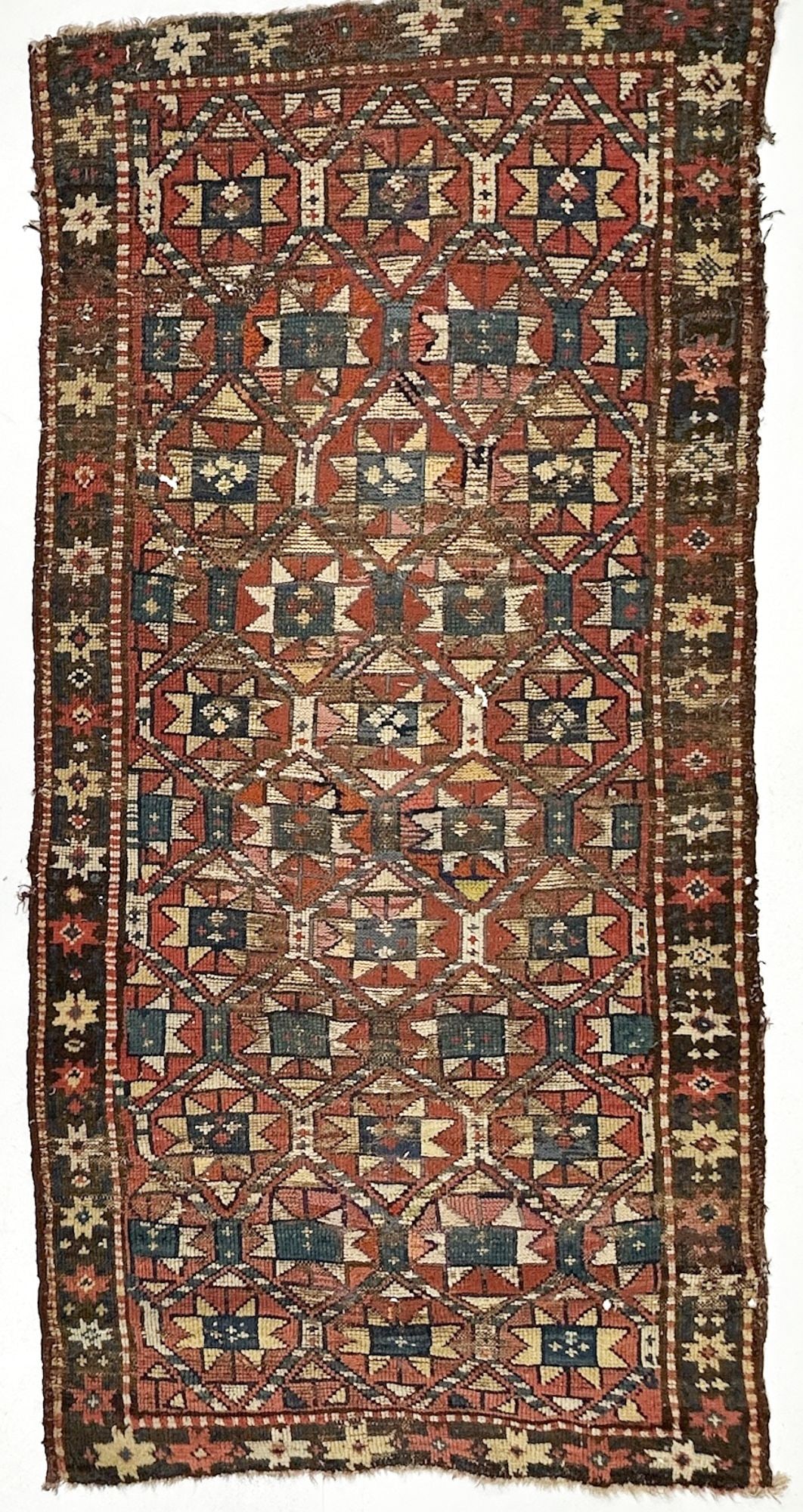 Caucasian Shirvan Hand-knotted Wool Rug, Circa 1920, 4.5' x 2.5': Red/Indigo. Hand-knotted. Wool. Dimensions: Rug is approx. 59 in W x 29 in L. Weighs 2 lbs 14 oz. LOCAL PICK UP INFORMATION:Wednesday, September 16, 10:00 AM-2:00 PM at 8059 Foothill Blvd, Sunland,
