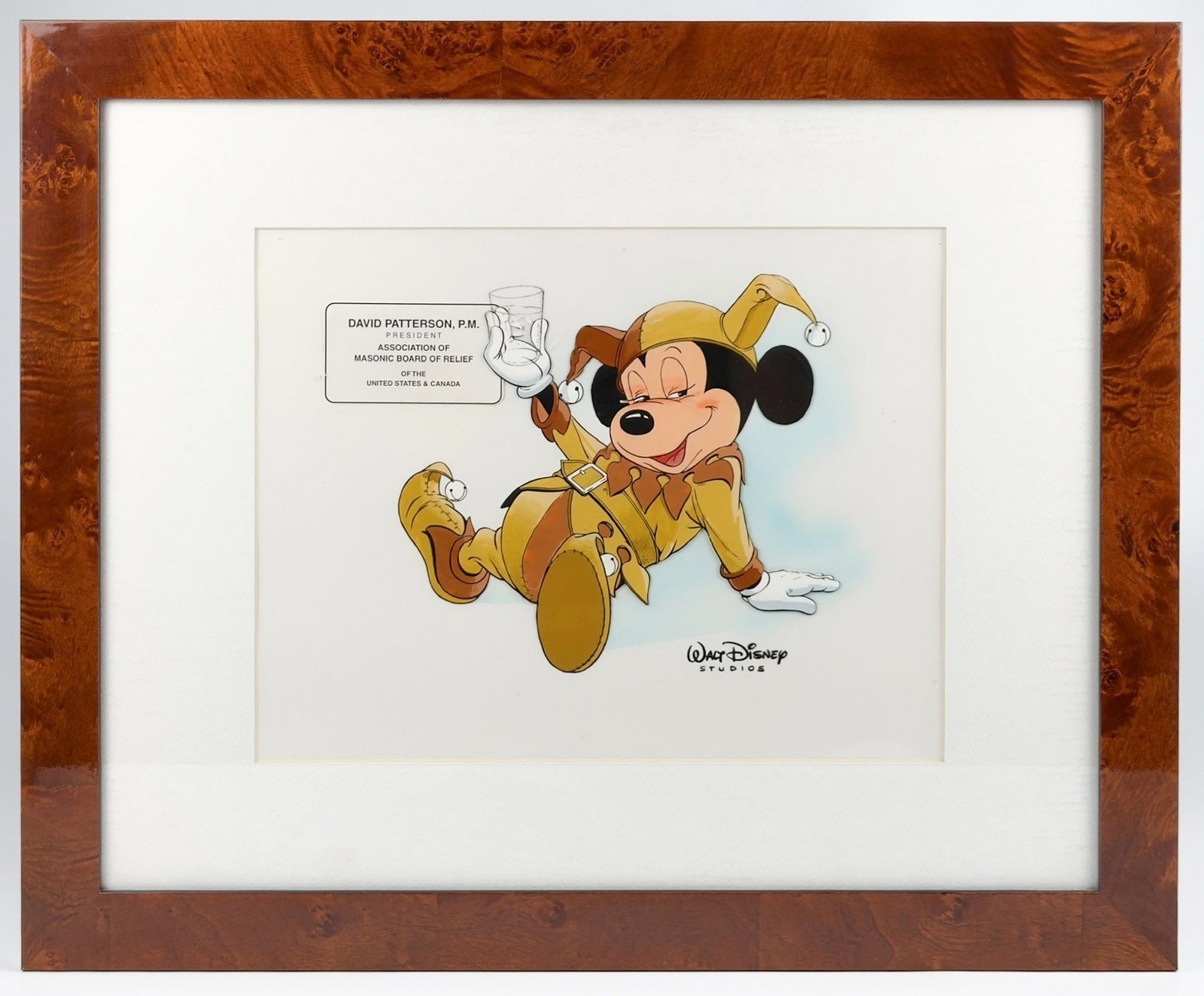 Vintage Walt Disney Hand Painted Cel Drunk Jester Mickey Mouse: Hand painted cel depicts Mickey Mouse in a brown and tan jester outfit with jester hat. He appears drunk and holds a glass in his right hand. Signed by Walt Disney Studios in the bottom right corner. 