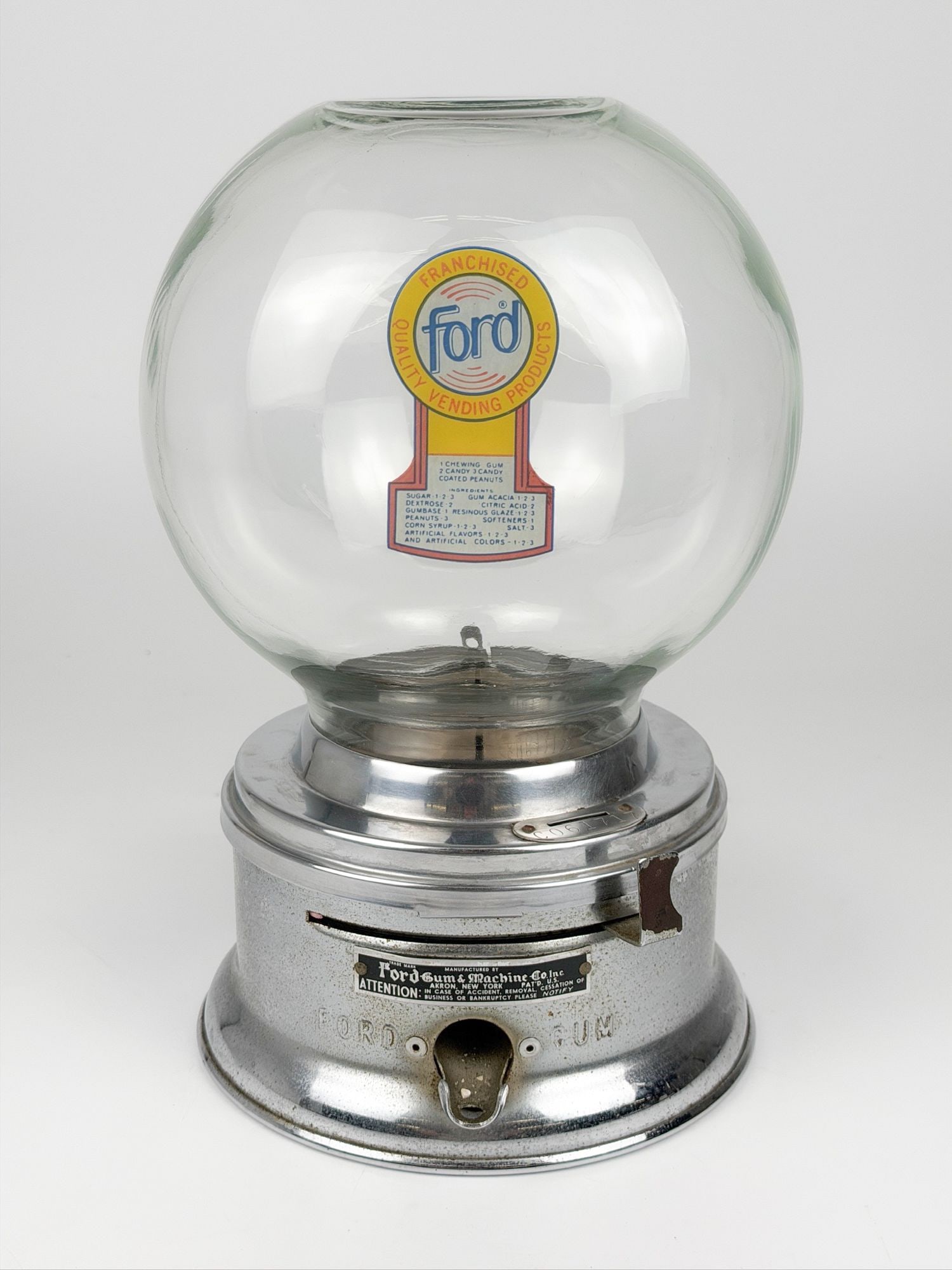 Antique Ford Gum & Machine Co. Gumball Machine: Coin operated gumball machine made by Ford Gum & Machine Co. Inc. Glass bowl with metal base. Dimensions: Approximately 11.5 in H x 7 in W x 7 in D. Weighs approximately 5 lbs 8 oz. LOCAL PICK UP INFO