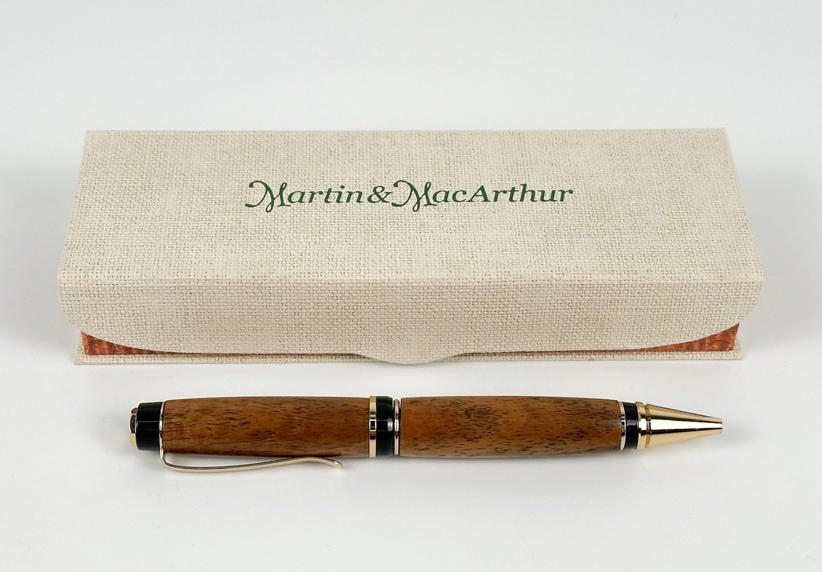 Martin & MacArthur Maui Koa Wood Ball Point Pen: Wood grain. Original box. Dimensions: Pen box is approx. 1.25 in H x 6.75 in W x 2.25 in D. Weighs 1 lb. LOCAL PICK UP INFORMATION:Wednesday, September 16, 10:00 AM-2:00 PM at 8059 Foothill Blvd, Sunl