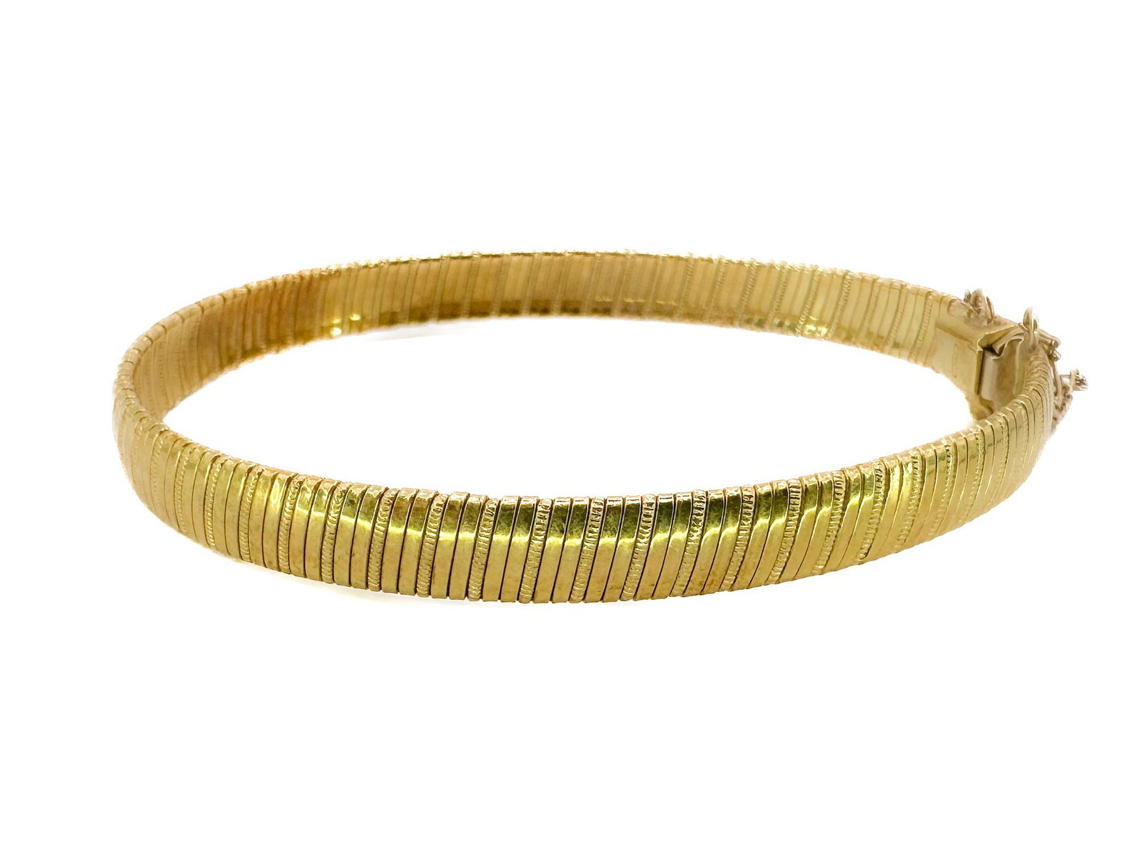 18K Yellow Gold Omega Link Bracelet: 18K yellow gold omega link bracelet. Dimensions: Weighs 19.8 grams. Interior circumference is 7 inches, and the bracelet is .25 inches thick. Features a box clasp with a safety chain. LOCAL PICK UP IN