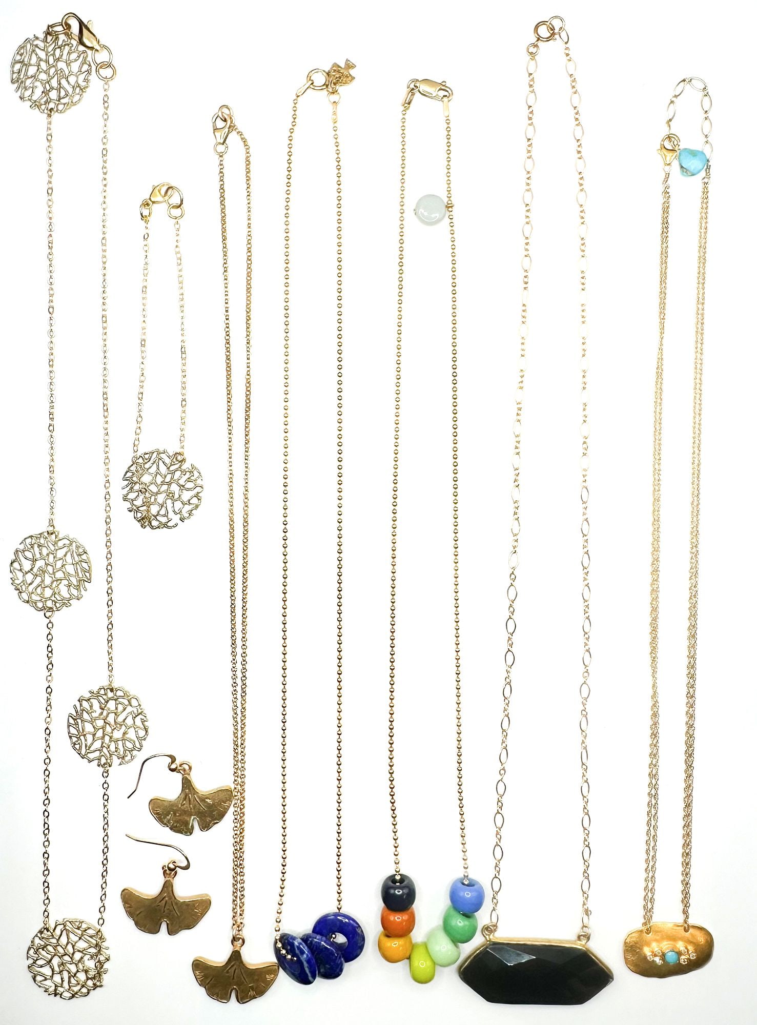 Lot of 8 Designer Gold Filled Pendant Necklaces, Bracelet, Earrings: Most marked gold filled. Includes lapis and bead cluster, onyx pendant, lattice bracelet and necklace set, and ginko leaf earring and necklace set. All clasps function. Necklaces lengths range from 18