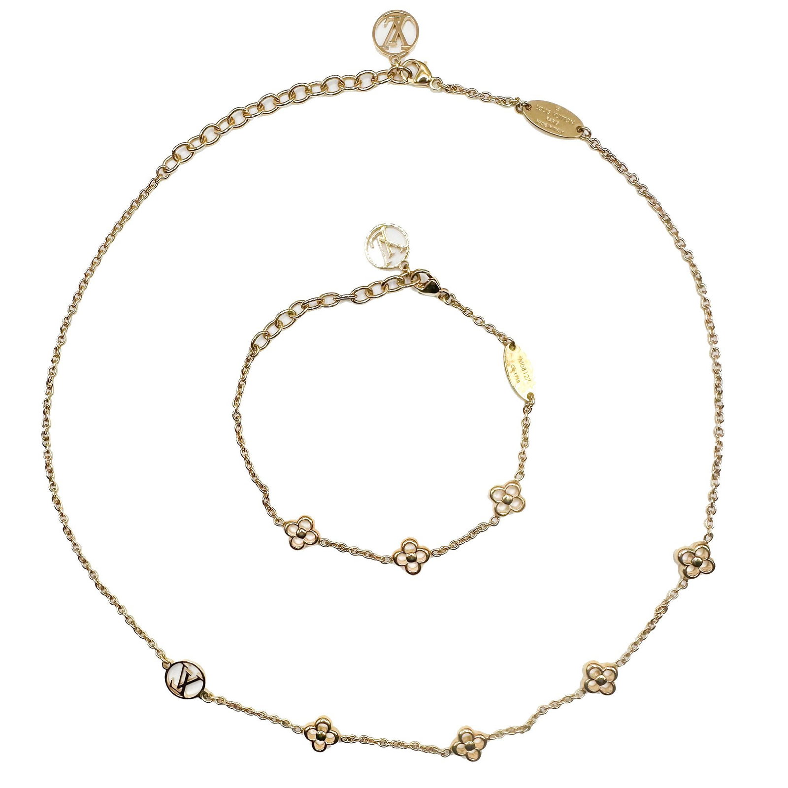 Louis Vuitton Gold Plated Flower Necklace and Bracelet Set: Each items has an engraved serial number. Excellent condition. Both include extender segments. Necklace is 17 inches long. Bracelet is 7 inches. LOCAL PICK UP INFORMATION:Wednesday, September 16, 10:0