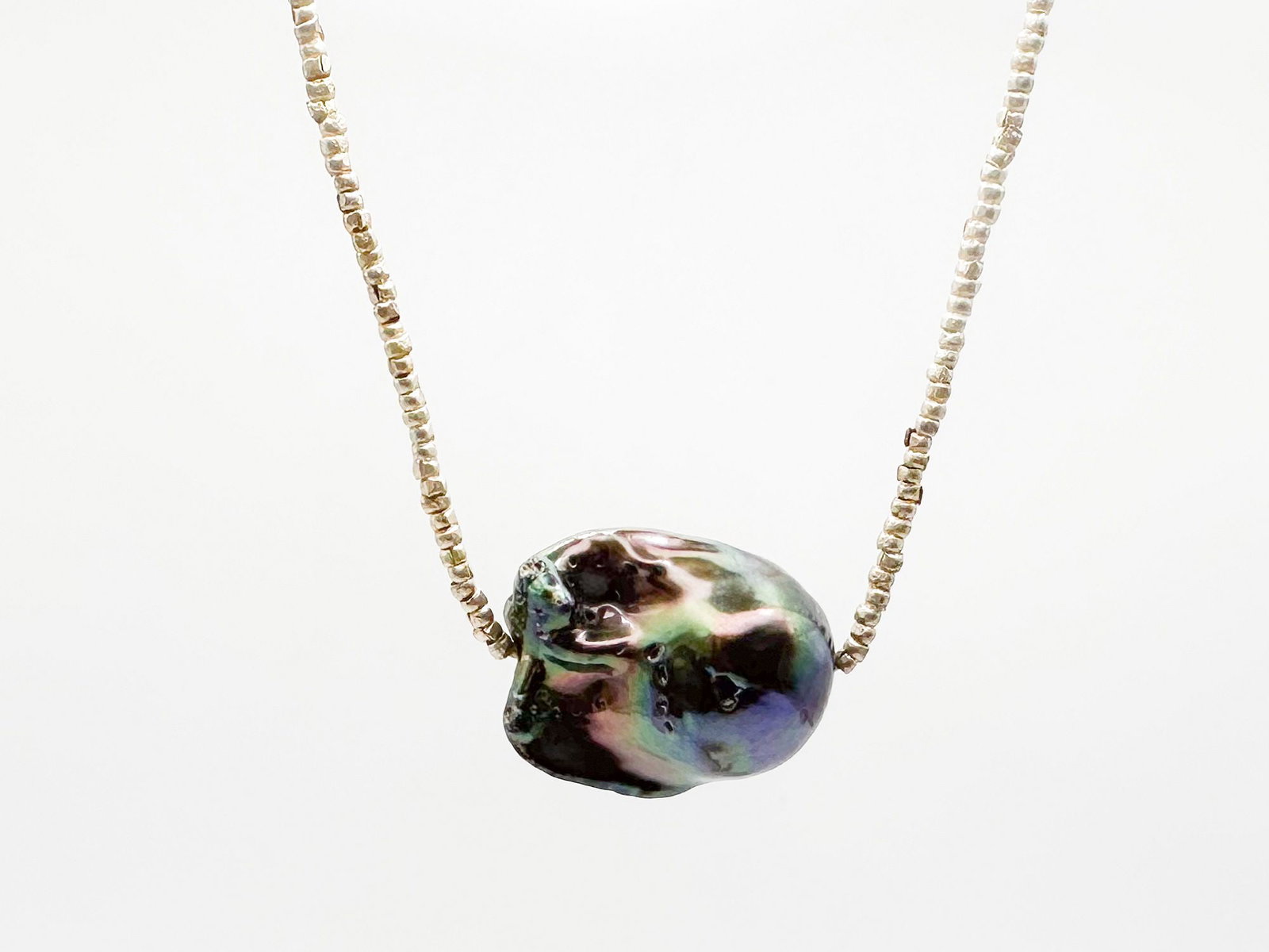 Baroque Black Pearl & Sterling Silver Bead Necklace: 16-inch necklace featuring a baroque black pearl (approx. 3/4 inch wide) and sterling silver beads. Includes a lobster clasp. Weighs 8.8 grams. LOCAL PICK UP INFORMATION:Wednesday, September 16, 10:00