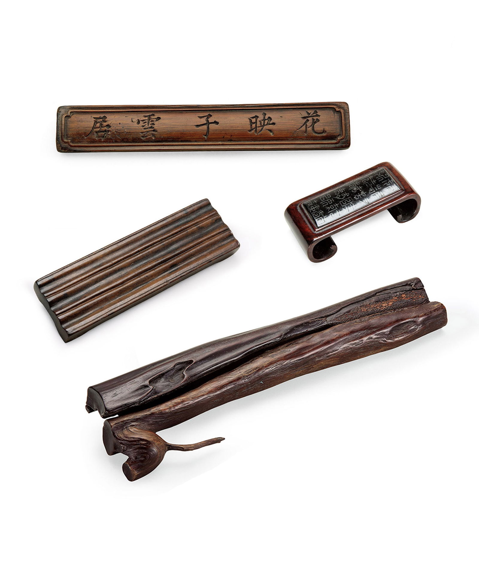 Carved Bamboo Paperweight, a Hongmu 'Poem' Brush Rest, a Silver-Inlaid Wood Ink Stand and a Zitan: 291 清 竹雕鎮紙、紅木詩文筆床、木嵌銀絲墨床、紫檀自然