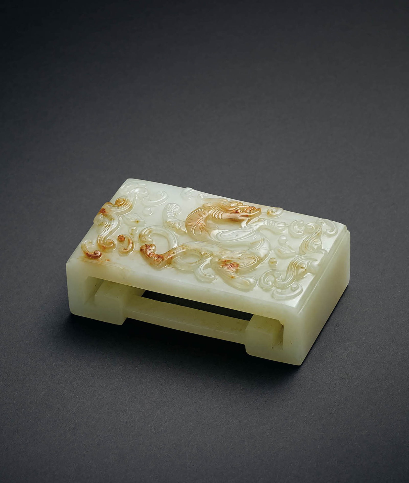 White Jade 'Dragon' Ink Rest, Qing Dynasty: 578 清 白玉龍紋墨床 「春耦齋」款 L7.7cm 預估價： TWD 80,000-100,000 RMB 17,400-21,700 Yu Jen Taipe