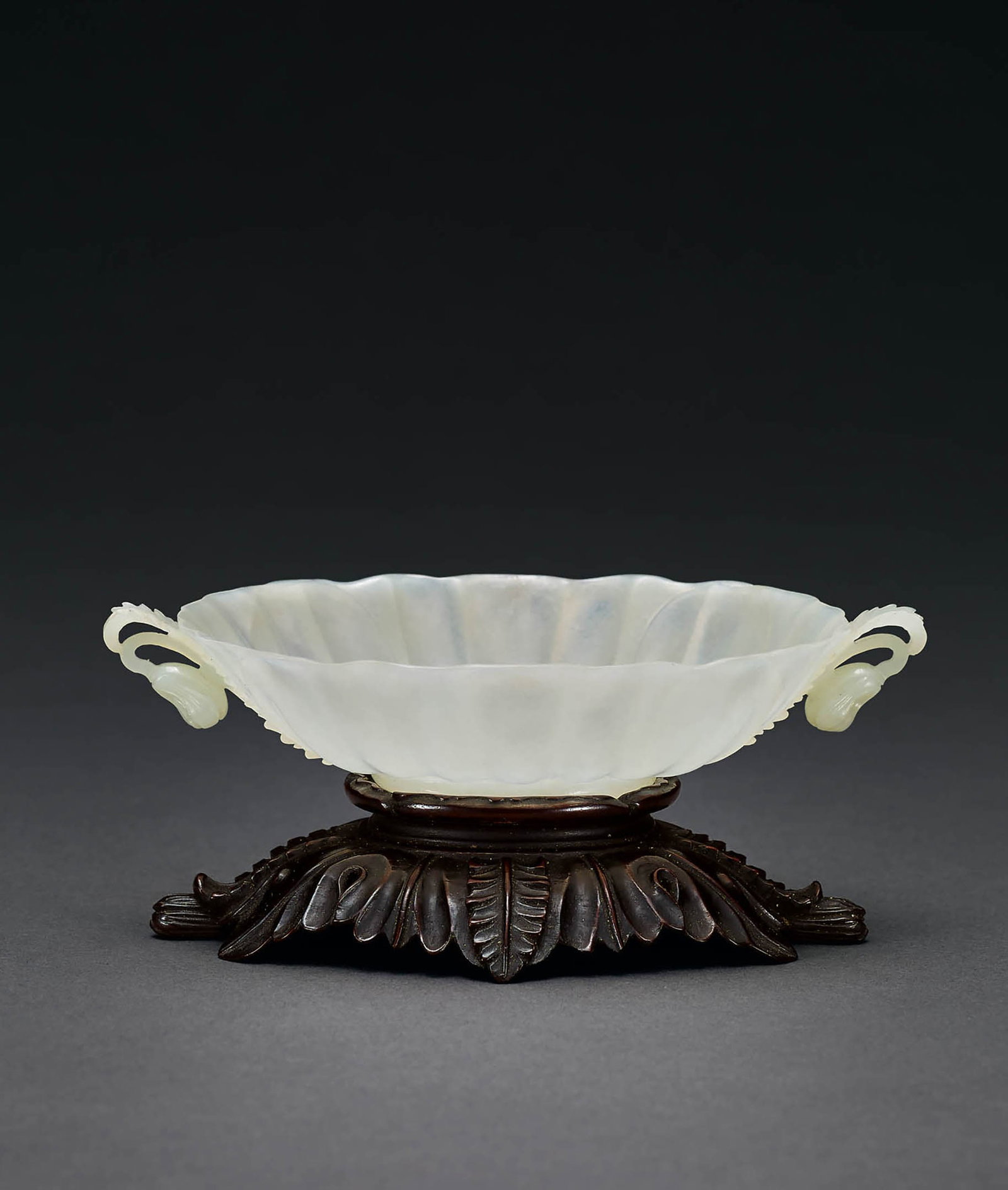 White Jade 'Vetch Leaf' Cup, Qing Dynasty: 587 清 白玉莨苕葉紋杯 W13cm 白玉質，細緻凝潤，薄透輕巧，展
