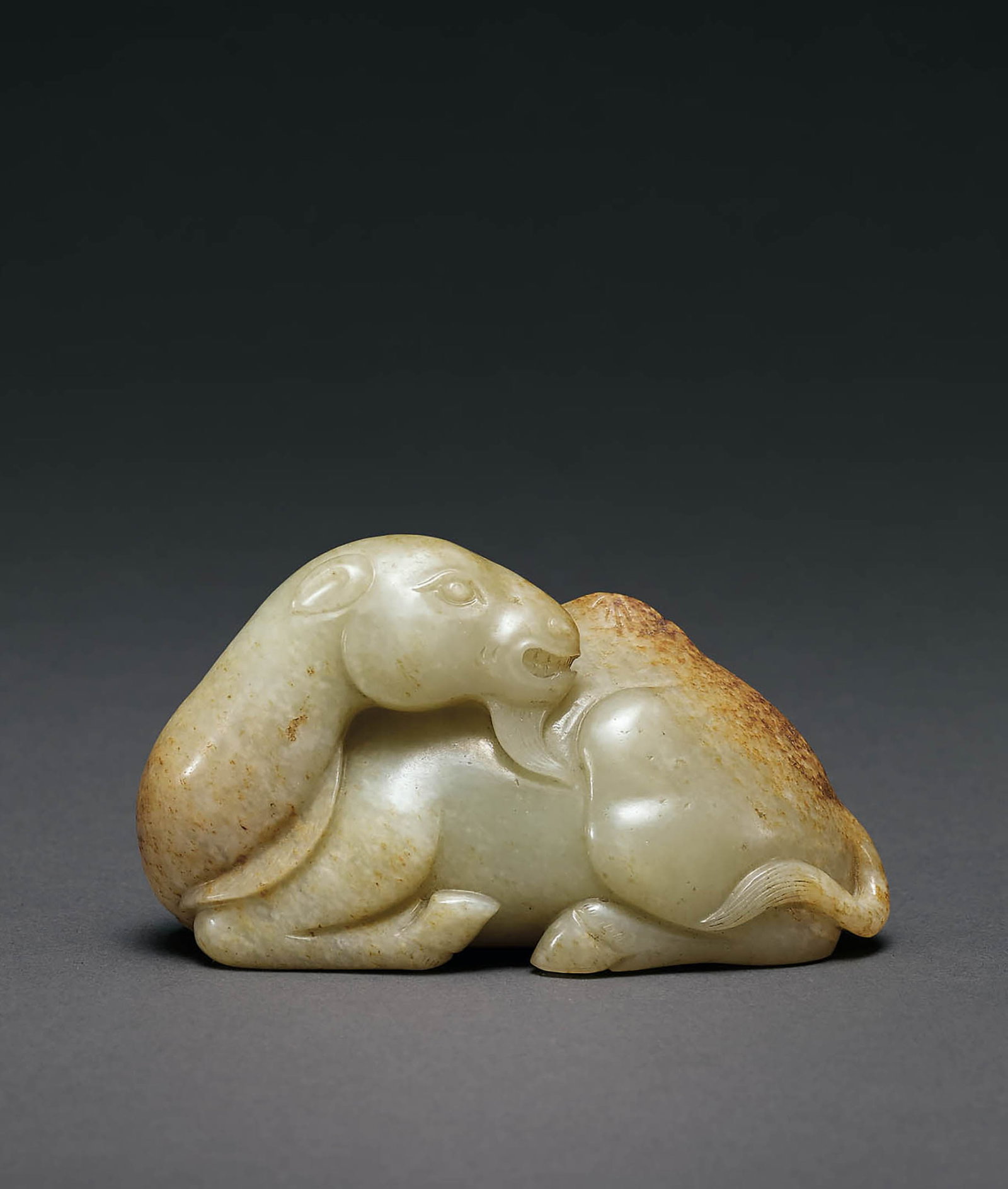 Jade Camel, Qing Dynasty: 593 清 玉駱駝 L10.2cm 預估價： TWD 150,000-180,000 RMB 32,600-39,100 Yu Jen Taipei 台北宇珍拍賣 A JADE CAMEL QING DY