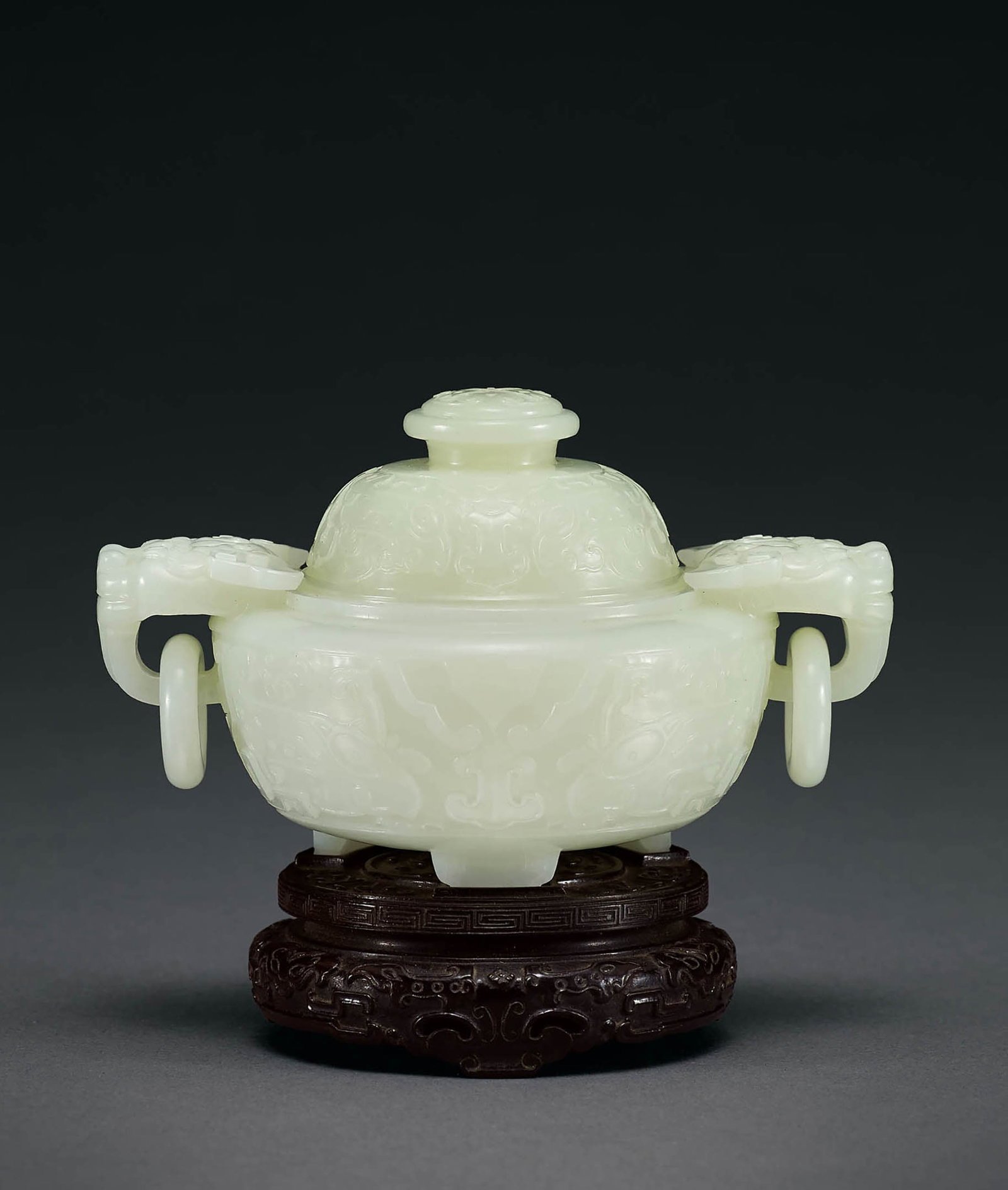 White Jade Beast-Mask Tripod Censer & Cover, Qing: 606 清 白玉獸面紋龍首銜活環耳三足蓋爐 W13.2cm 白玉質，溫潤細&#