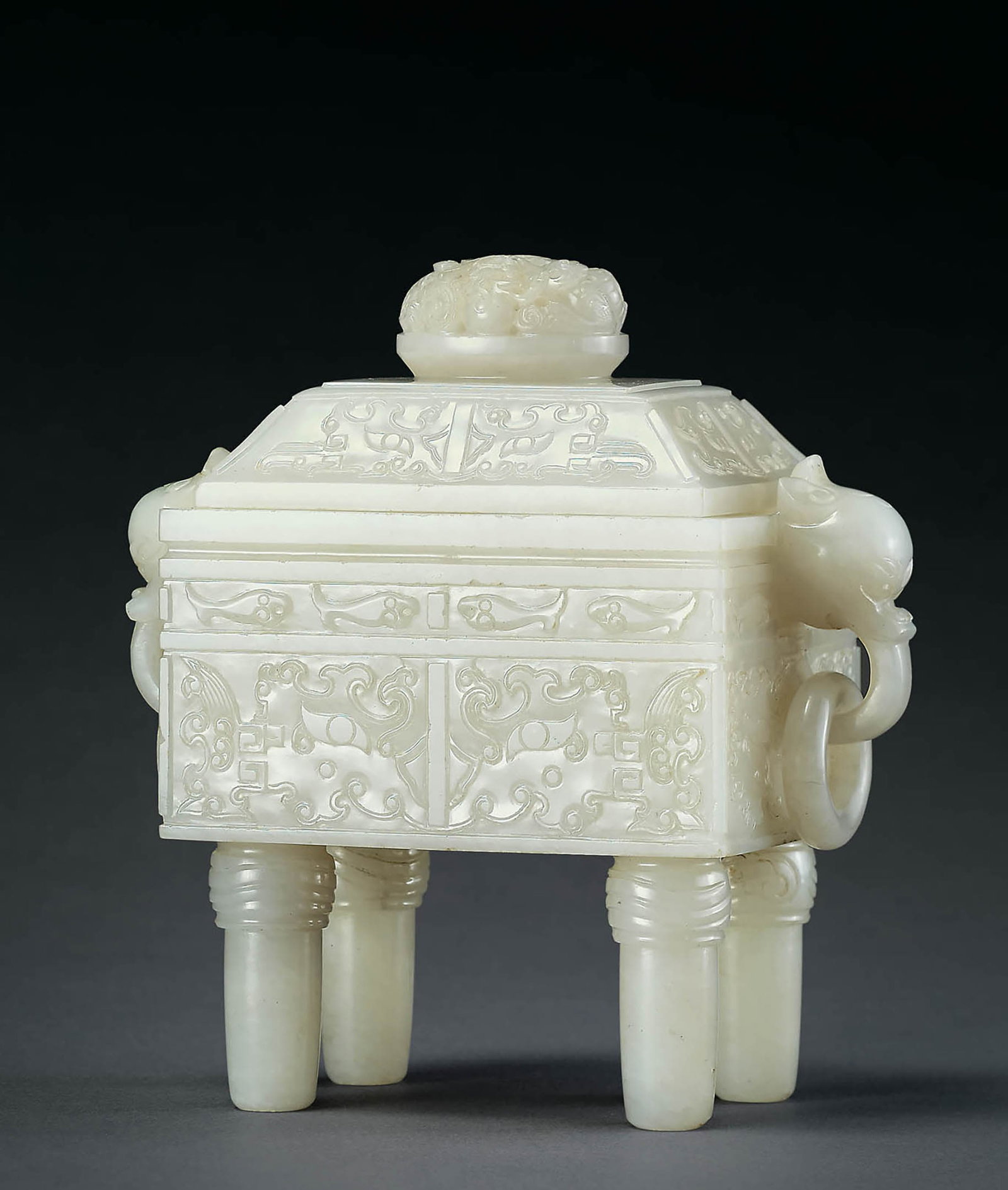 White Jade 'Beast Mask' Vessel and Cover, Qing: 607 清 白玉獸面紋獸首銜活環耳蓋鼎 H15.2cm 白玉質，質地緻密瑩&#