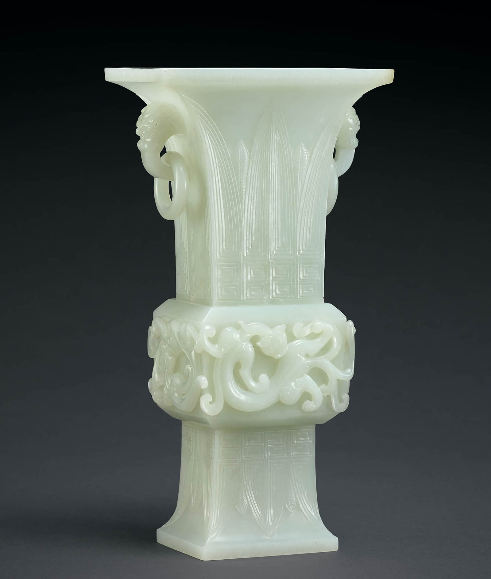 Fine White Jade 'Dragon' Vase, Gu, 18th C: 615 十八世紀 白玉龍紋獸首銜活環耳觚 「乾隆年製」款 H26.5cm 觚&