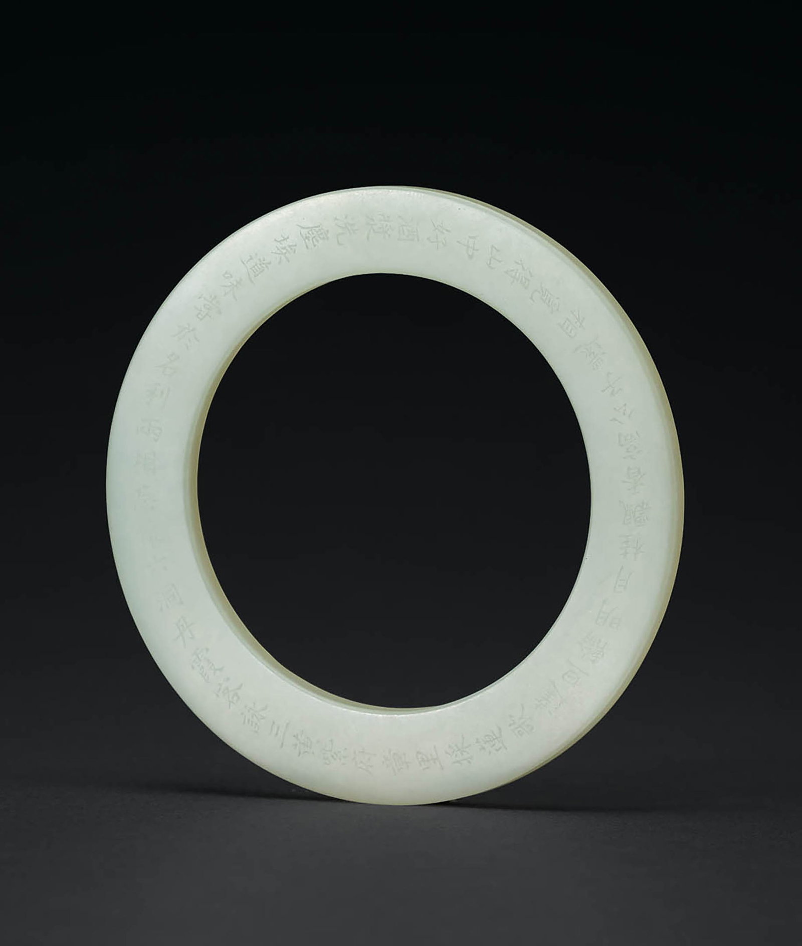 Inscribed Pale Celadon Jade Ring, Qing Dynasty: 621 清 青白玉詩文環 D8cm 款識：洗塵埃道味甞 於名利兩相忘 懷