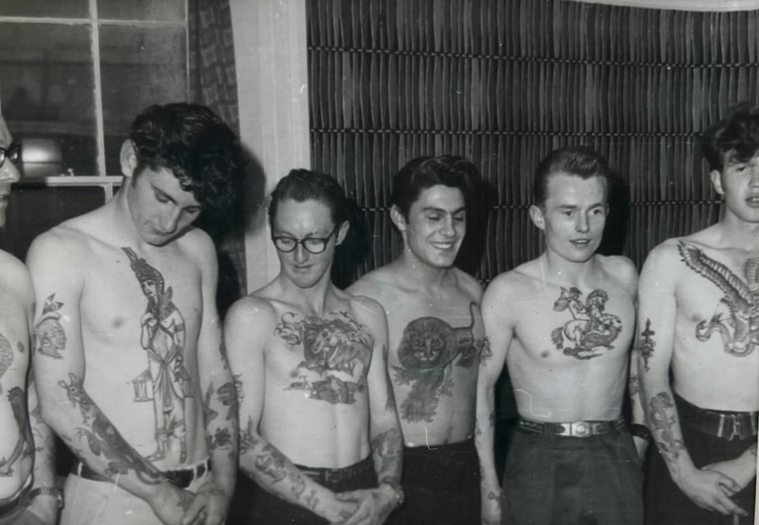 Tattoo Artist (Ron): Photograph of six tattooed guys with traditional tattoos from B.T.C., photo by Ron, 1963, 8.8x12.7cm