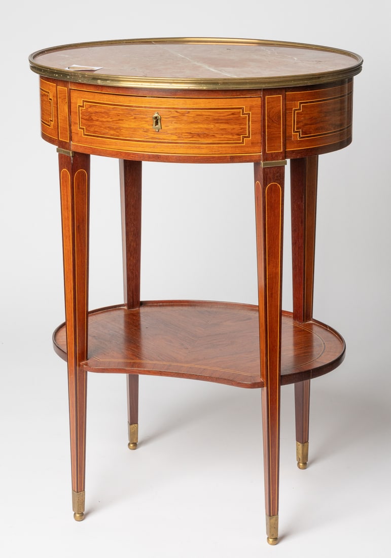 GUERIDON WITH MARBLE TOP IN LOUIS XVI STYLE: Bern, manufactured by Heinz Müller, 20th c. 73 x 52 x 41 cm Heinz Müller was an ébéniste based in Bern who was the last to represent Bern furniture art of the 18th and