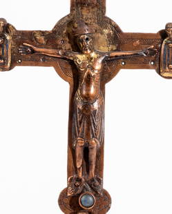 UNUSUAL CRUCIFIX: France, copper and bronze, engraved and applied, remains of gilding, probably 19th century using older parts. H: 34.5 cm (without base)