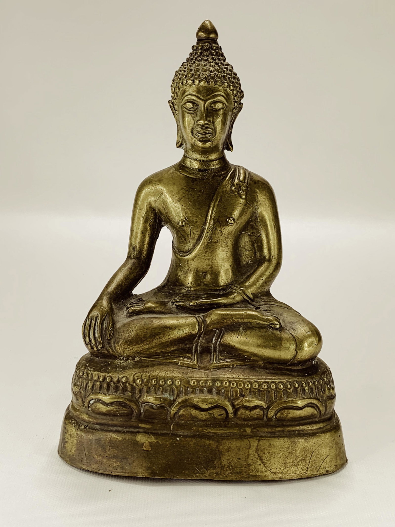 CHINESE MING DYNASTY BRONZE BUDDHA TIBET: Chinese Ming Dynasty Bronze Buddha Tibet: A very fine Qing dynasty Chinese gilt bronze figure of Shakyamuni, seated in the full lotus position on a lotus base. Gilt bronze.8" H x 5.50" W (in)