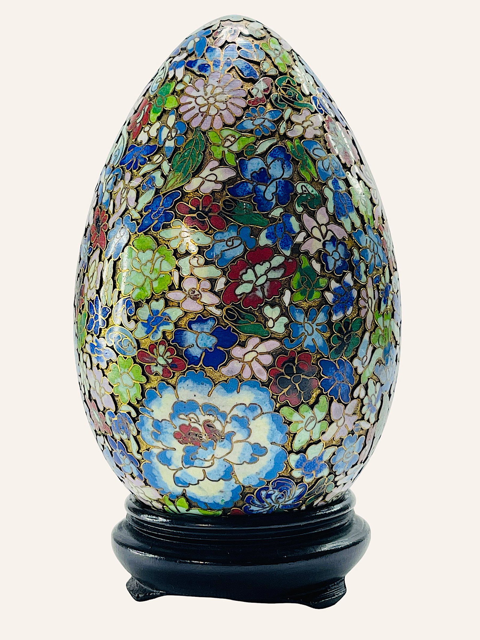 Large Chinese Cloisonne Egg with floral details.: A large decorative cloisonne egg in various shades, highly decorated with floral motifs. Early-mid 20th century. China. 7.50 "Tall (inches). Good condition.