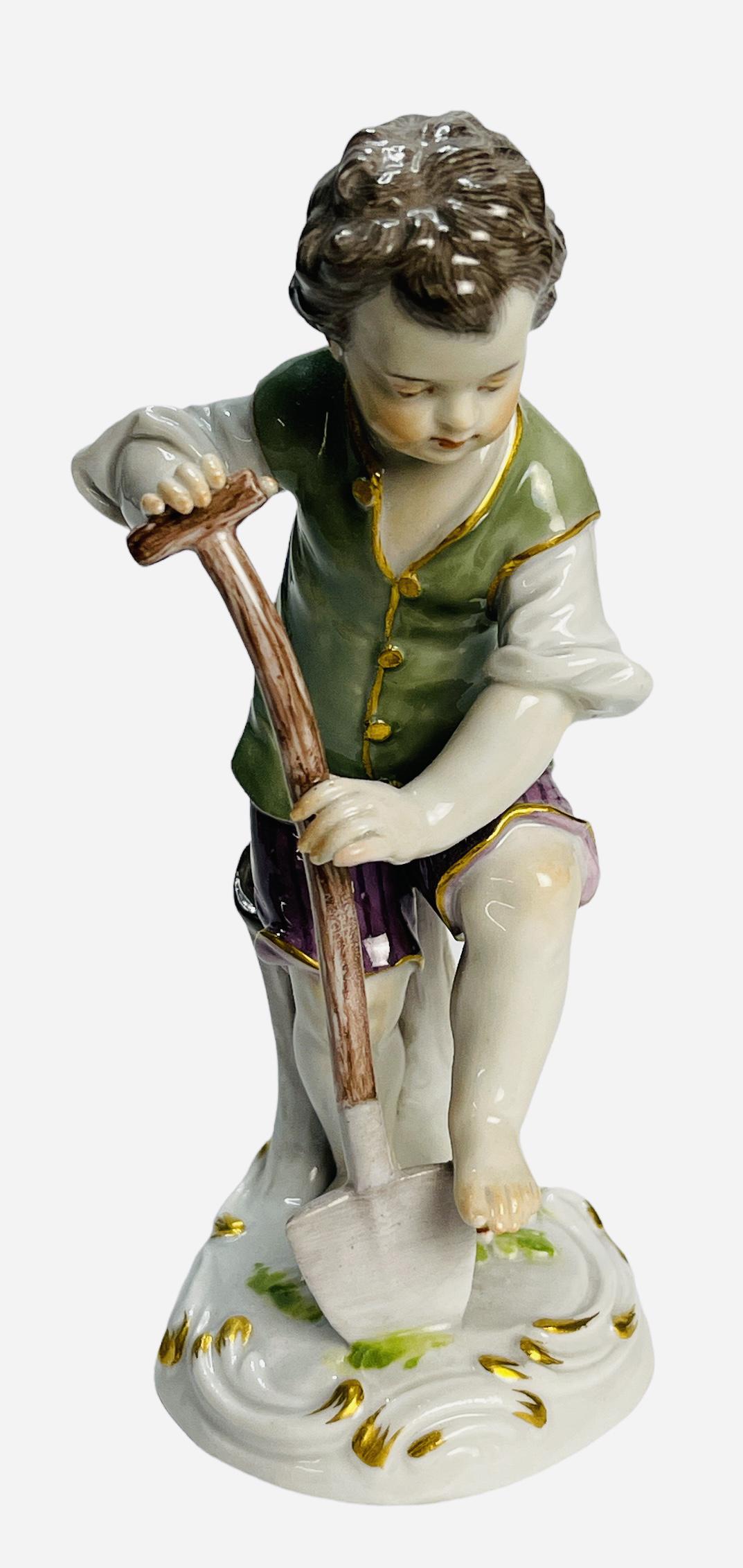 19th Century Meissen Porcelain of a boy with a shovel: Meissen porcelain of a boy with a shovel. From the 19th century. Numbered on the base. Measures 5" H x 2.50" W x 2.75" D (inches). Germany.