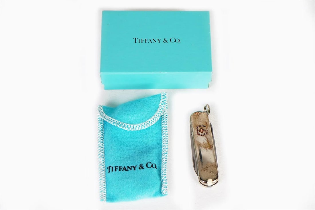TIFFANY & Co Sterling Silver 925 Swiss Army Victorinox Pocket Knife in Box.: TIFFANY & Co Sterling Silver 925 Swiss Army Victorinox Pocket Knife in Box. Looks like it has never been used. Does need to be polished a little.