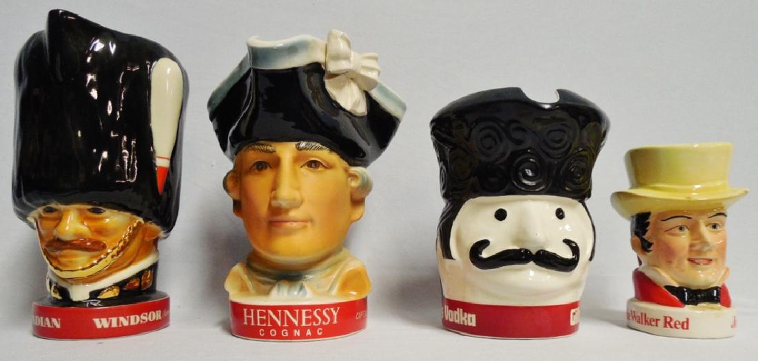 Lot of 3 Face Shapped Bourbon/Vodka Pitchers: Tallest one measures 8 1/4" H and NOTE: DAMAGE to Johnnie Walker Red Mug has chips on hat brim measures 5 1/2" H
