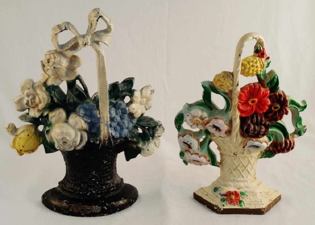 Lot of 2 Cast Iron Doorstops Flowers in Baskets: Taller one is 10 5/8" H; black basket (taller one) marked 121 and white basket marked 204