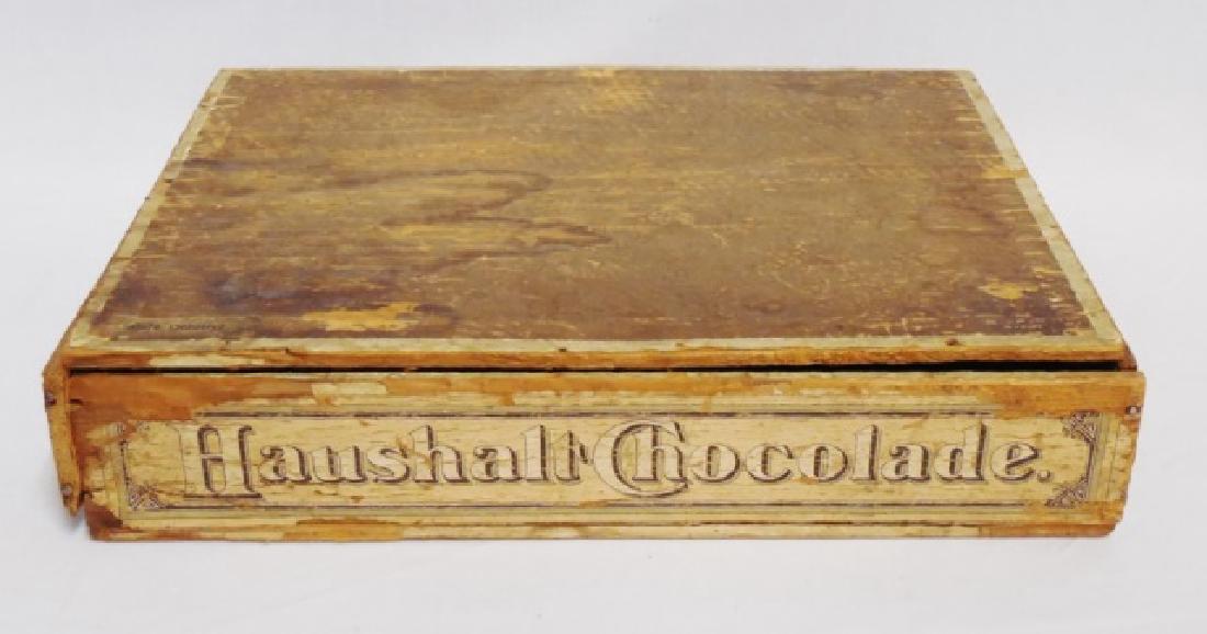 "Haushalt Chocolade" Wooden Box with Hinged Lid: measures 11 3/4" H x 2 1/2" H x 9" D NOTE: DAMAGE THE BOX IS COMING SLIGHTLY APART