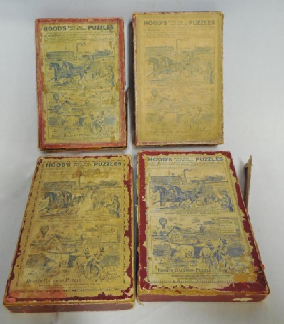 Lot of 4 "Hood's Rainy Day and Balloon Puzzles": NOTE: DAMAGE BOXES ARE VERY ROUGH AND COMPLETION OF PUZZLES IS UNKNOWN