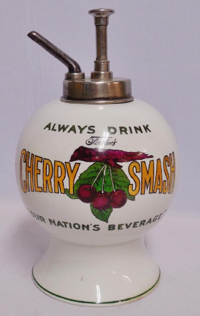 Fowler's Cherry Smash Ceramic Syrup Dispenser: measures 15" H, NOTE: HAS A HAIRLINE CRACK AT TOP APPROXIMATELY 2 1/2" L AND SMALL CHIP ON THE BOTTOM. THE PUMP IS MARKED FOWLER'S ROOT BEER