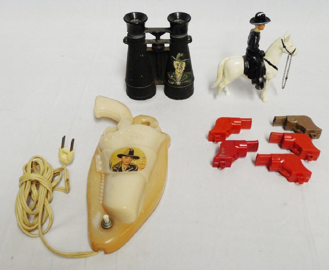 Hop-A-Long Cassidy Assorted Lot: including Might Light Binoculars, gun whistles, night light, and a man on a horse NOTE: HORSE IS MISSING HALF OF ITS BACK LEG