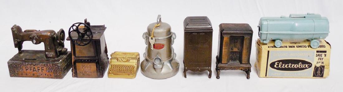 Lot of 7 Banks of Household Items: the Electrolux Bank with box is plastic and the Record Player is the tallest measures 5" H