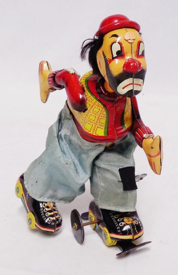 Tin Windup Clown Roller Skater: NOTE: WINDING KEY DOES NOT FUNCTION PROPERLY