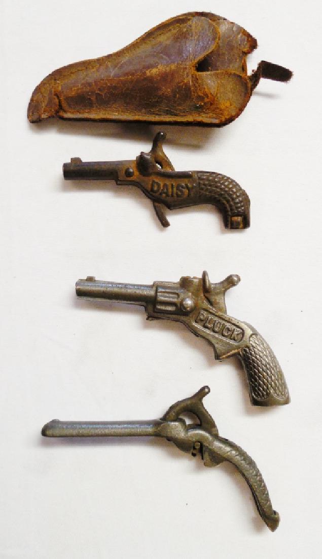 Lot of 3 Miniature Cap Guns: and 1 small leather holster NOTE: WHICH HAS SOME DAMAGE
