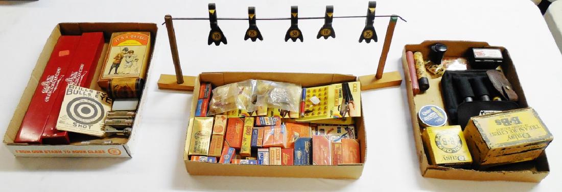 Assorted Cap and BB Gun Accessory Lot: including caps, 12 Cal. Edison Montecarlo Noise Shells, 3 Match Safes, 2 Daisy BB Gun Cleaning Kits, Wooden Plinker Target, BB's, and more