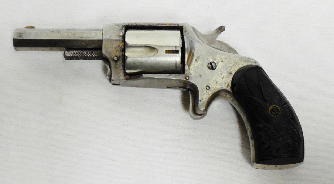 Defender Model 89 32 Cal. Spur Trigger Revolver: 2 1/2" Octagonal Barrel, 2 piece hard rubber grips with Eagle Seal NOTE: DOES NOT ACTION PROPERLY AS-IS