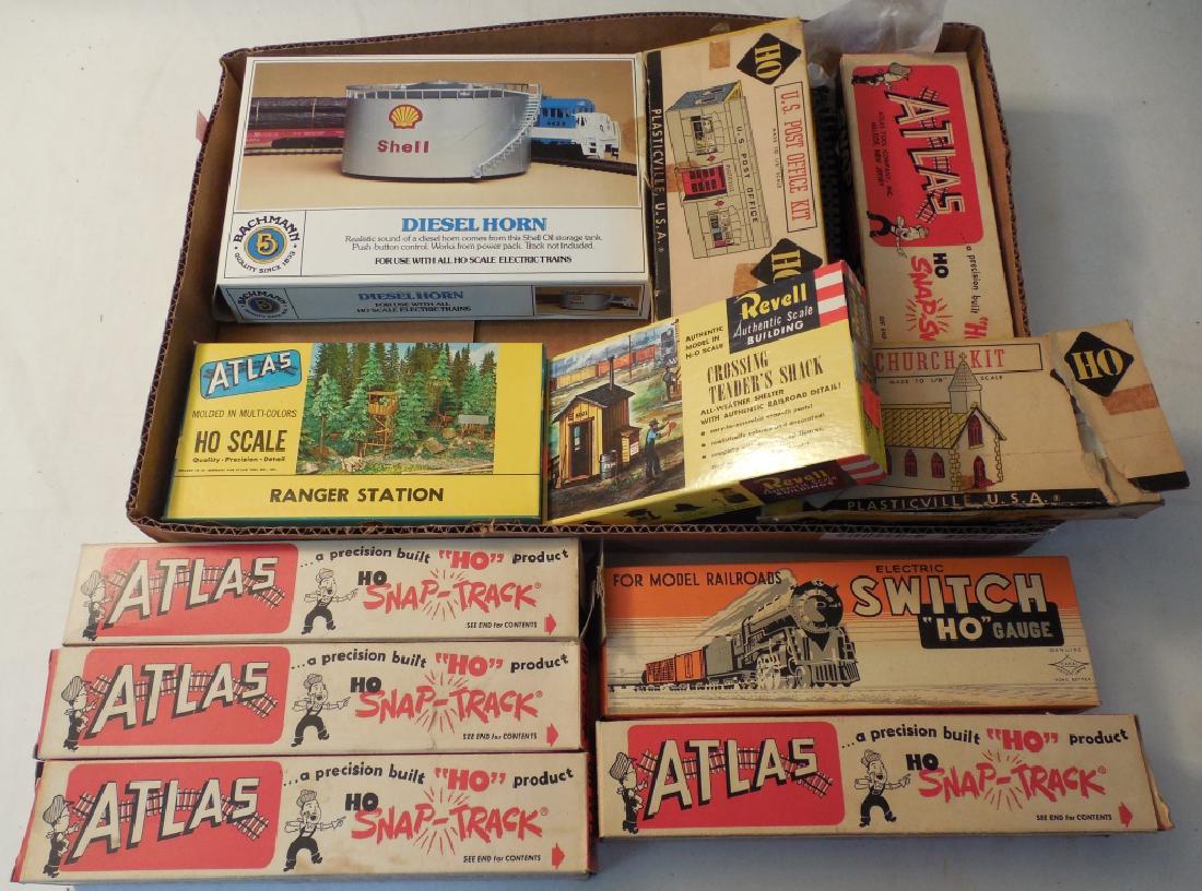 Lot of HO Accessories: HO track in boxes, Shell diesel horn, Atlas ranger station, Revell crossing tender's shack, US post office, church