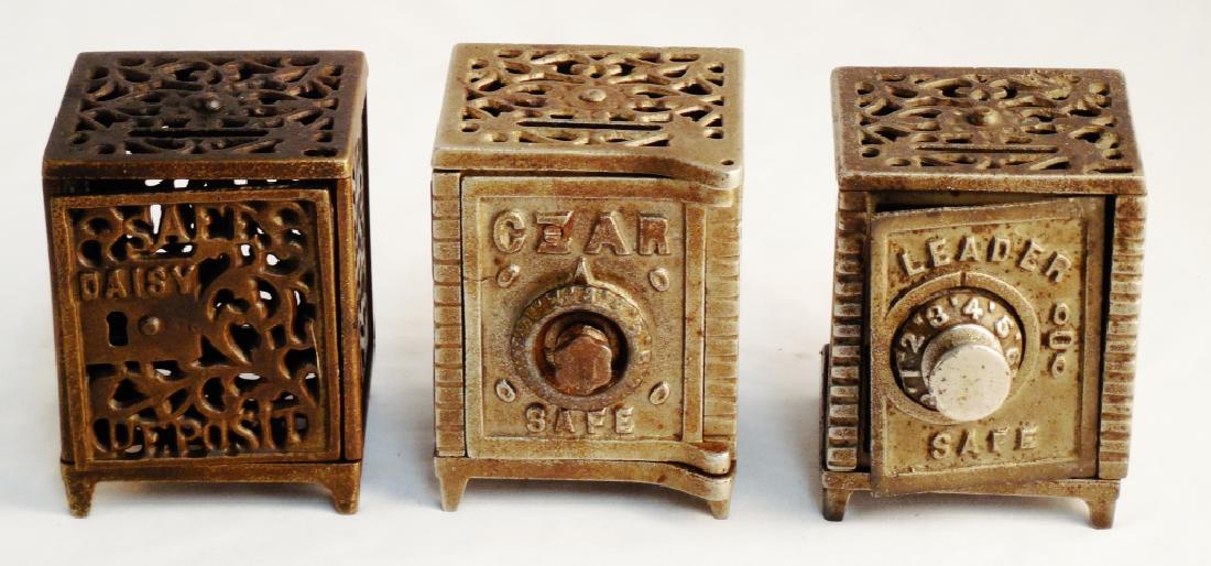 Lot of 3 Cast Iron Banks: Leader Safe, CZAR Safe, and Daisy Safe Deposit
