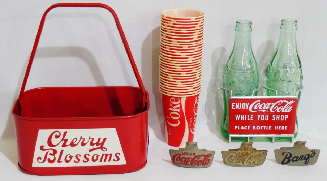Assorted Beverage Lot: Cherry Blossoms Tin Bottle Holder, 3 bottle openers, Coca Cola cups, and a 2-Bottle Cart Holder with 2 Coca Cola bottles