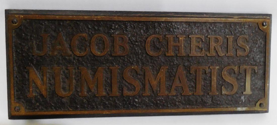 Jacob Cheris Numismatist Plaque: measures 25" L x 6" H