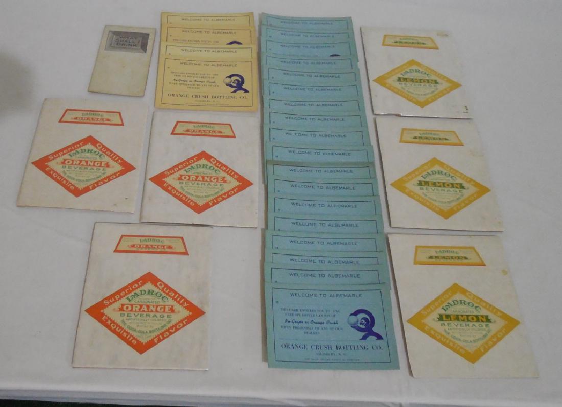 Lot of 3 Beverage Advertisements: 1) 1915 Buckeye Root Beer Trade Card - Mechanical 2) 22 Organe Crush Free Carton Cards and 3) 6 Ladrox Orange Bottle Labels