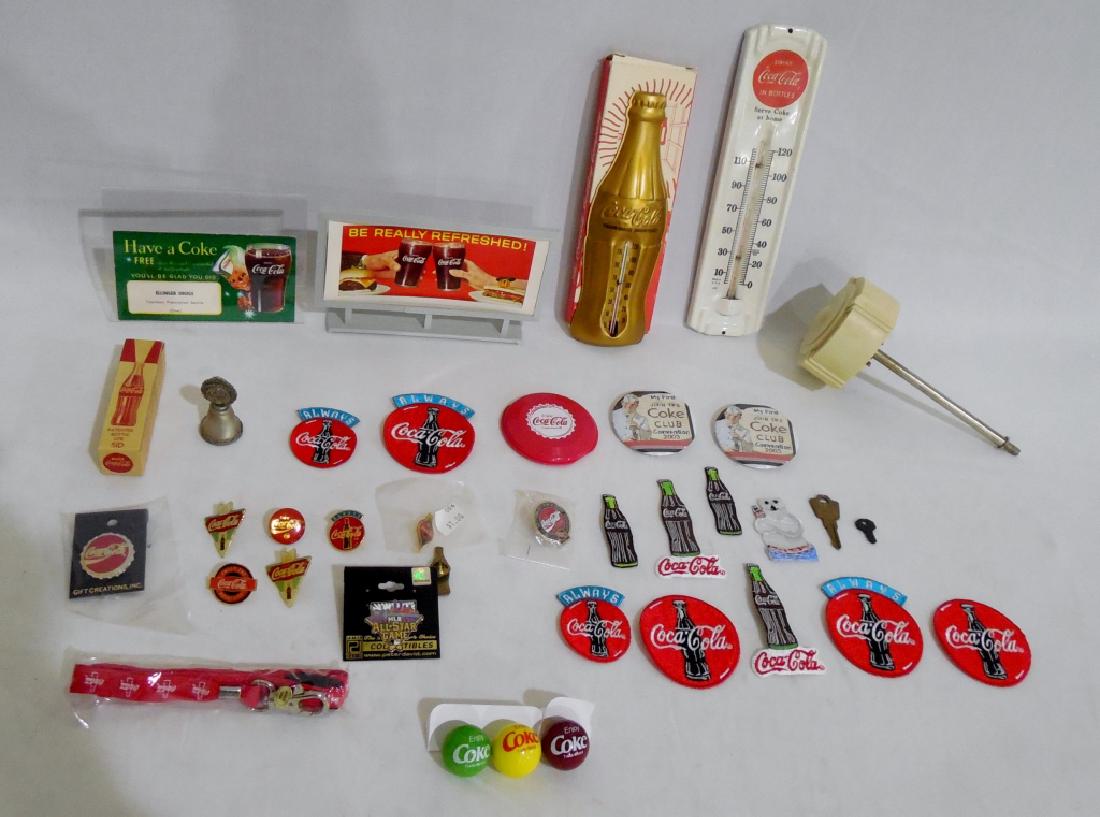 Assorted Coca Cola Collectibles Lot: magnets, marbles, thermometers, patches, pins, and more