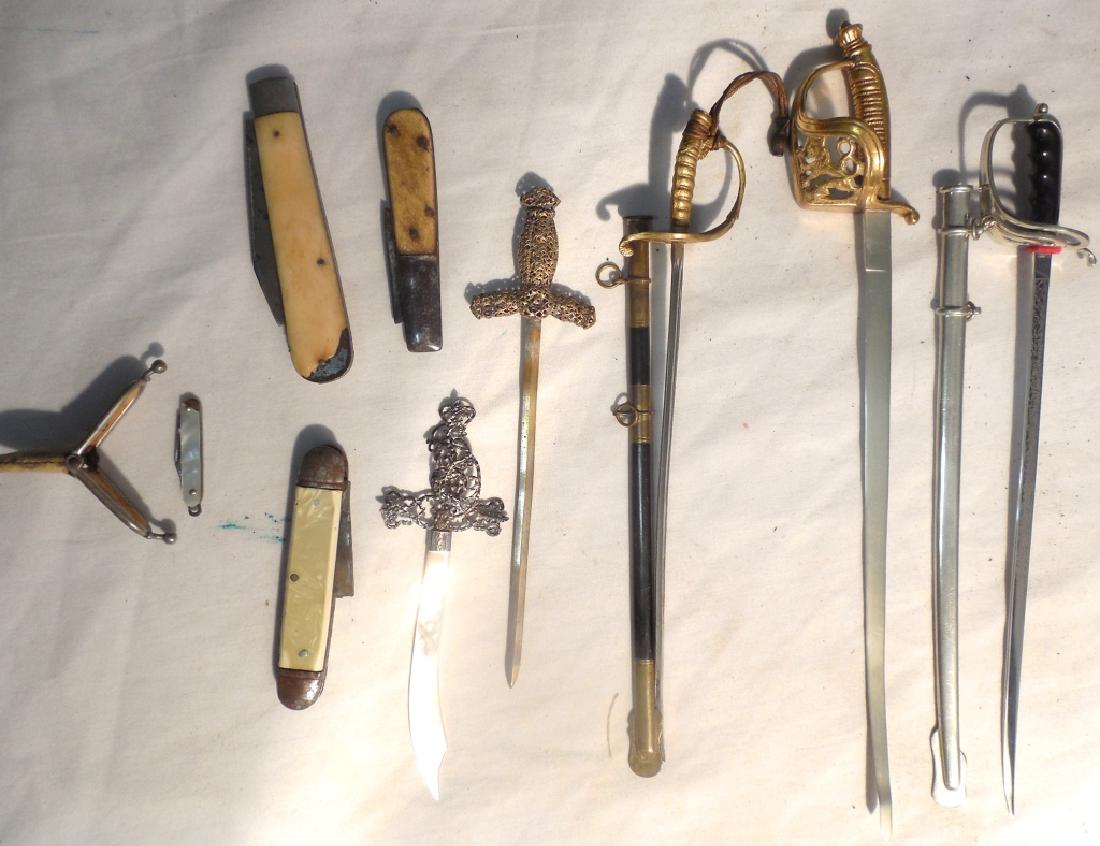 Sword letter openers and pocketknife: some damaged, a is