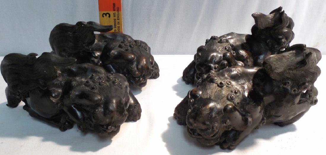 4 Chinese Lion Foo Dog Bronze (used): 6" long, notched on bottom to hang