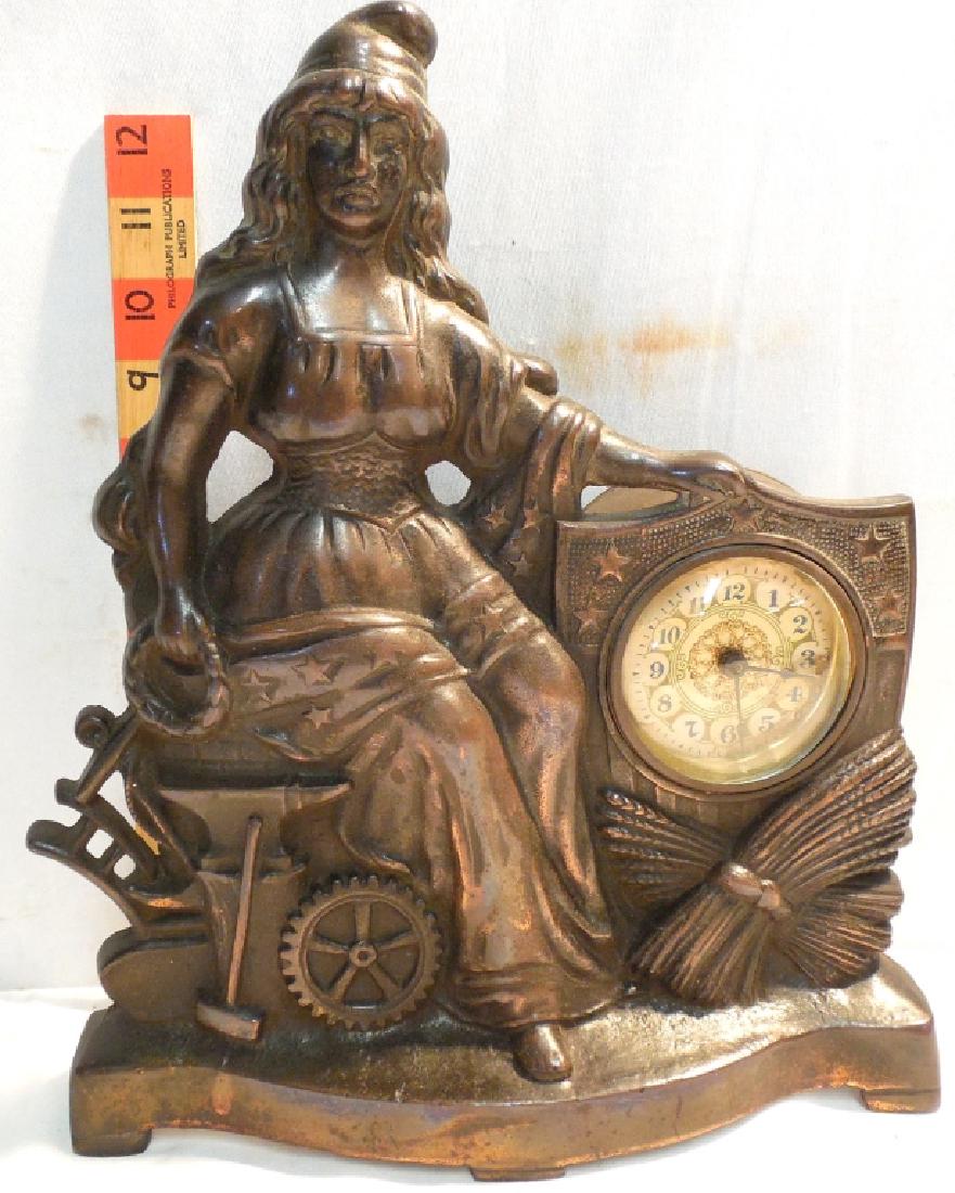 Cast sitting Lady Liberty Clock ?: door stop / Mantle clock