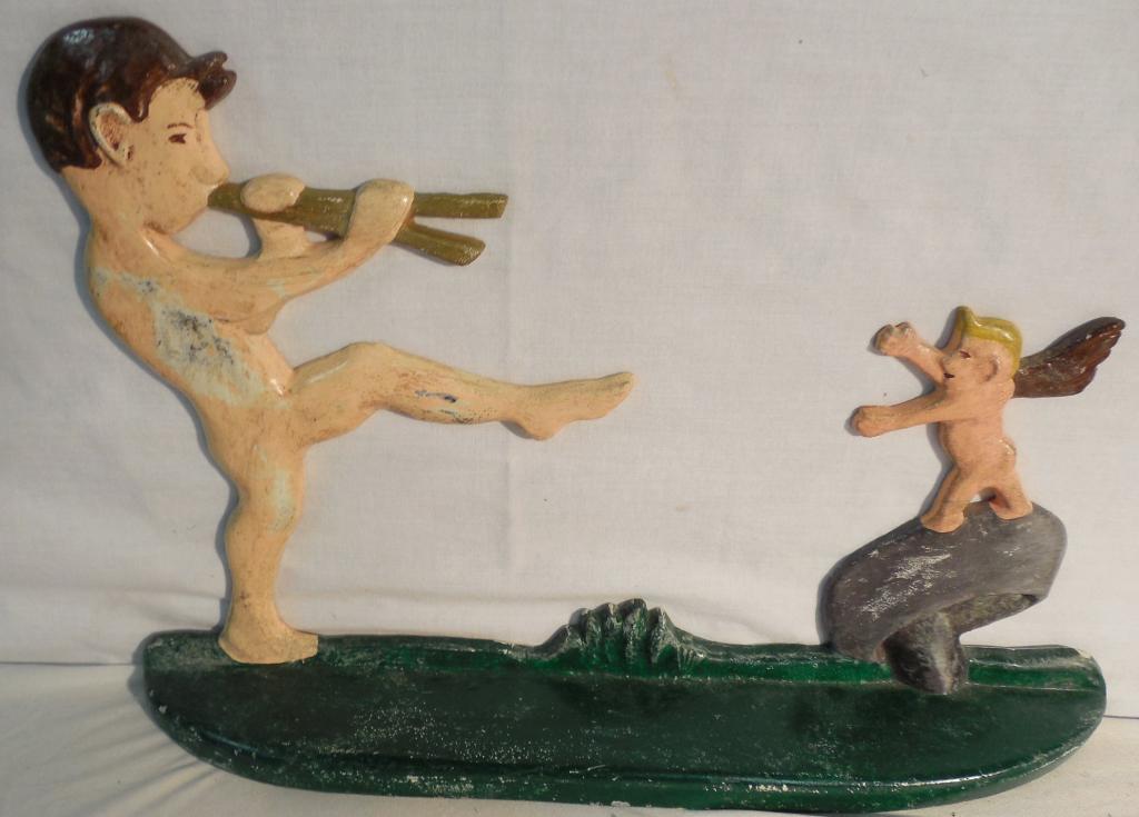 Cast-iron doorstops Boy with Flute: 9 1/2 inch tall by 13 3/4 inch wide boy with Flute