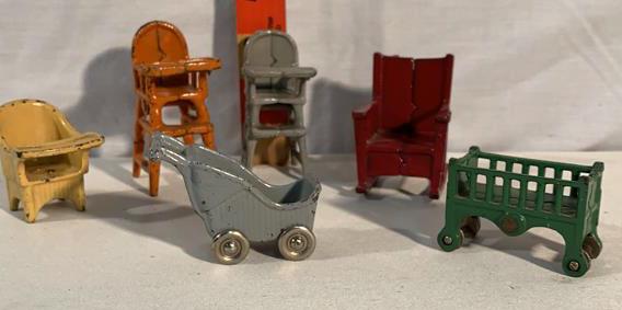 7 Cast-iron Toys High Chair's Rocker Crib More: 3 high chairs 1 rocker 1 crib 1 baby Carriage 1 scooter - scooter marked Kilgore